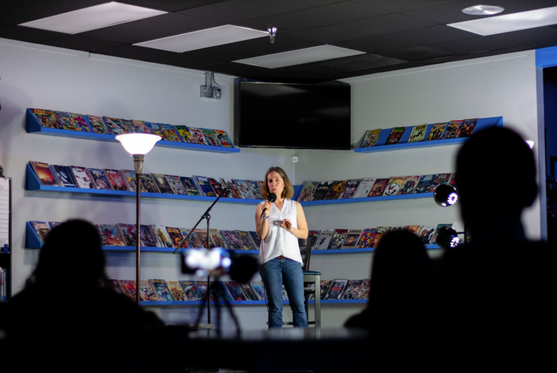 Georgia speaking at a bookstore event